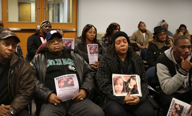 Thelma Thomas, second from right, of Merrillville, mother of missing person Rochelle Thomas Stubblefield, listens to investigators Friday during a news conference seeking the public's help in the case. -Damian Rico/Photo (The Times)